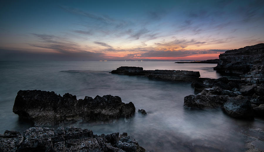 Rocky Seascape with dramatic beautiful sunset Photograph by Michalakis Ppalis