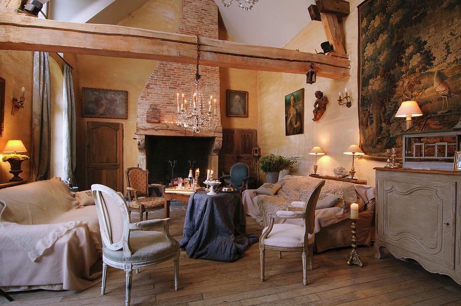 Rococo-style Armchair And Sofa Around Table Draped With Table Cloth In Rustic Living Room With Exposed Wooden Beams Photograph by Christophe Madamour