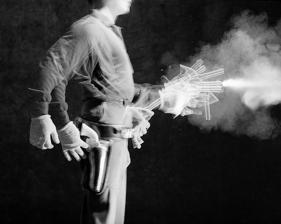 Black And White Photograph - Rodd Redwing Fires Revolver by Ralph Crane