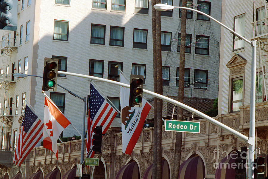 Rodeo Drive Street Sign And Flags, Beverly Hills Photograph