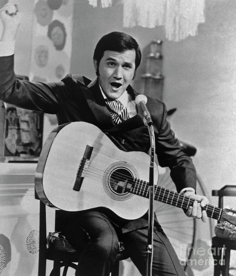 Roger Miller Singing And Playing Guitar Photograph by Bettmann
