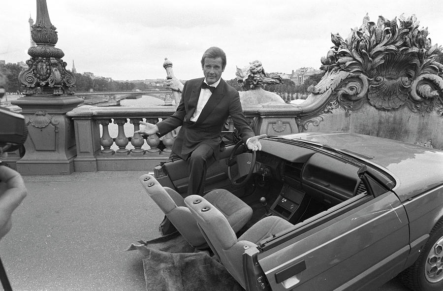 Roger Moore In Paris Photograph by Larry Ellis