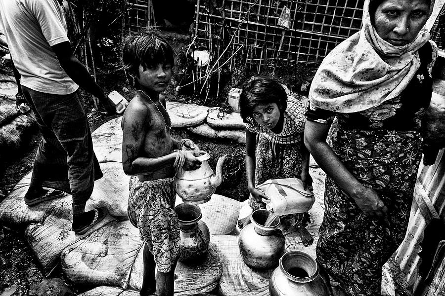 Rohingya People Drawing Water From A Pit - Bangladesh Photograph by ...