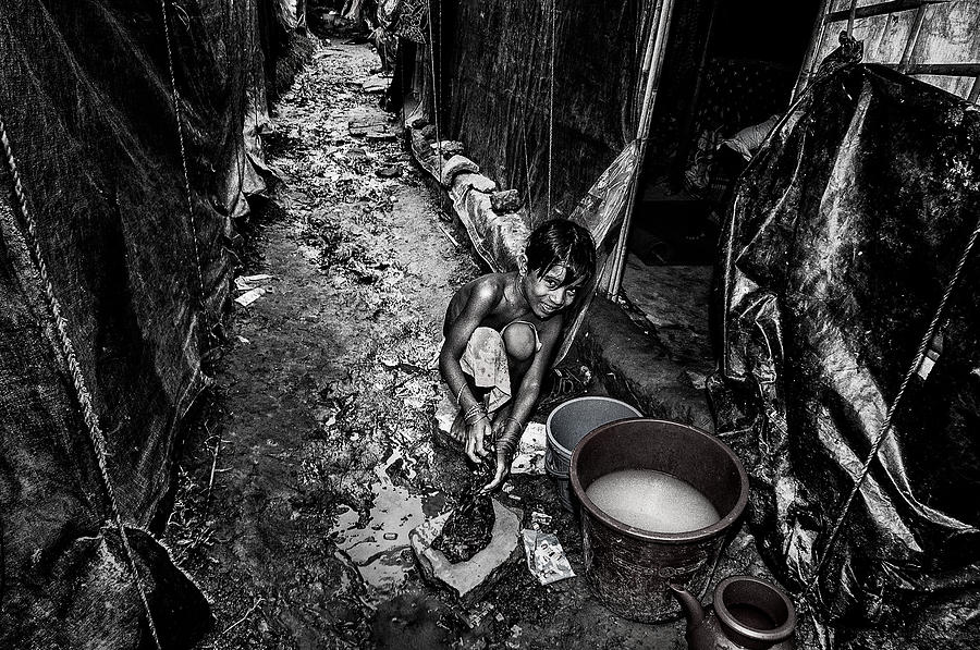 Rohingya Refugee Girl Cleaning Clothes In The Street, In Front Of Her ...