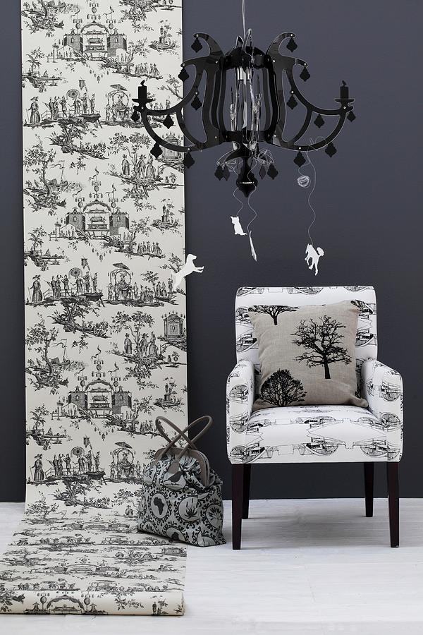 Roll Of Toile De Jouy Wallpaper On Black Wall Next To Armchair; Black Pendant Lamp In Foreground Photograph by Great Stock!