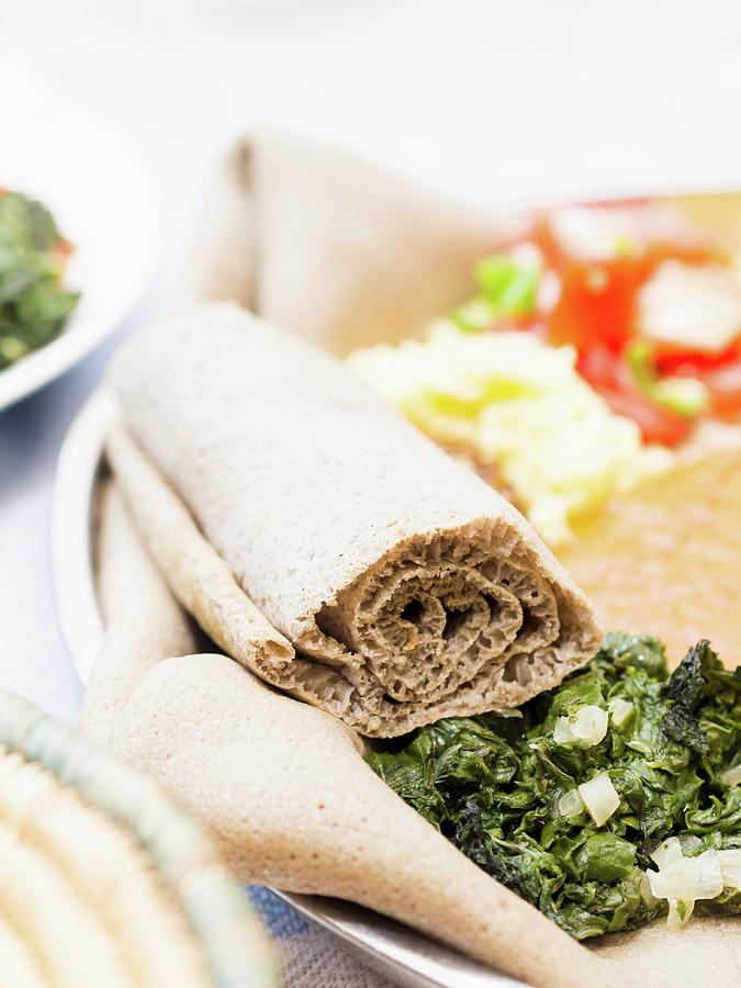 Rolled Ethiopian Injera Flatbread Made With Teff Flour Photograph By ...