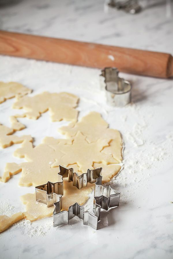 Rolled-out Biscuit Dough With A Star Cutter And Rolling Pin Photograph by Susan Brooks-dammann