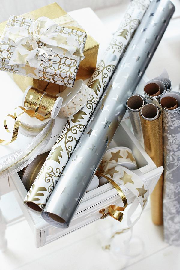 Rolls Of Festive Wrapping Paper And Ribbons Photograph by Biglife