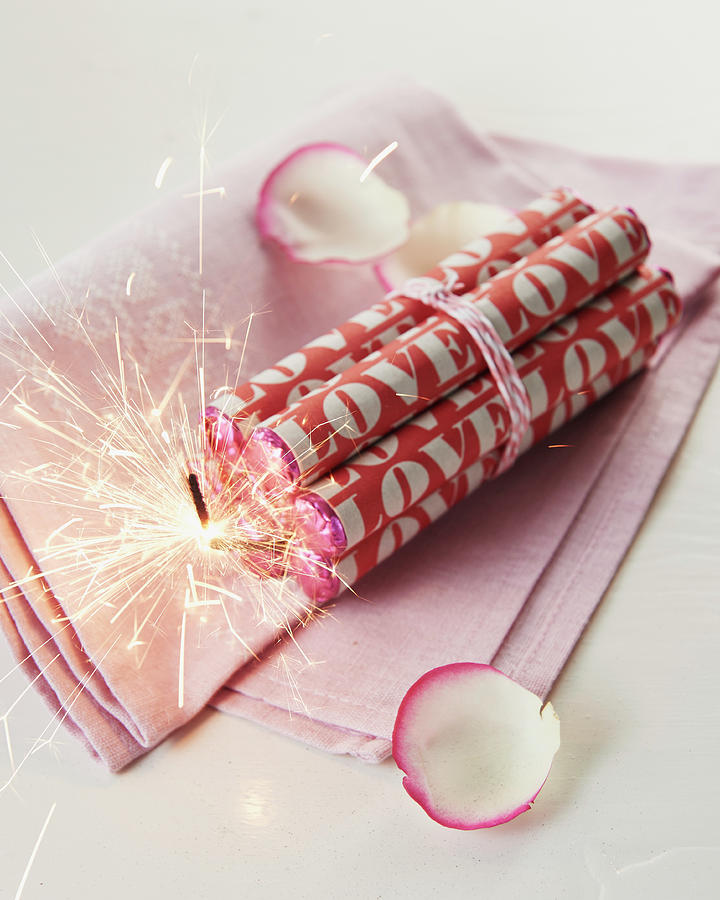 Rolls Of Love Bombs And Sparkler For Valentines Day Photograph by Hannah Kompanik
