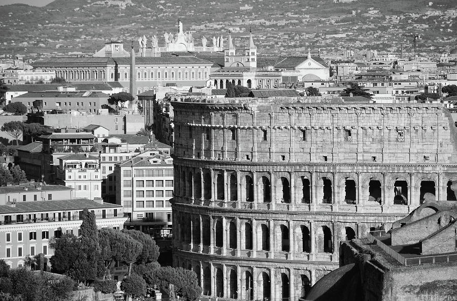Roman Colosseum and Modern Buildings of Central Rome Italy Black and White Photograph by Shawn OBrien