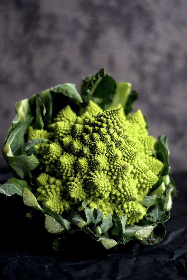 Romanesco Broccoli On A Dark Surface Photograph by Adriana Baran