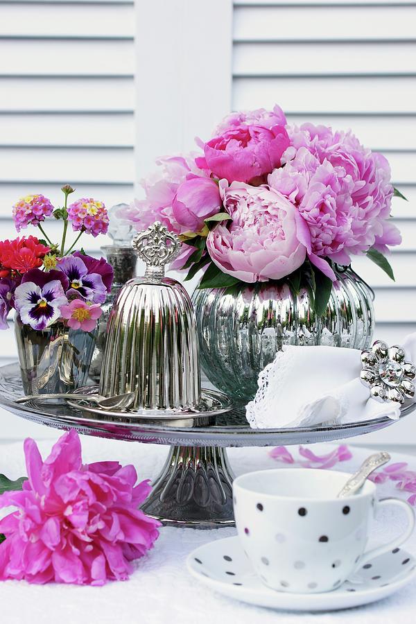 Romantic Arrangement Of Peonies & Silver Accessories On Table Photograph by Angelica Linnhoff