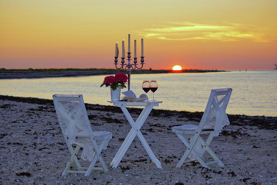 Romantic Candlelight Dinner On Beach At Sunset Photograph by Angelica Linnhoff