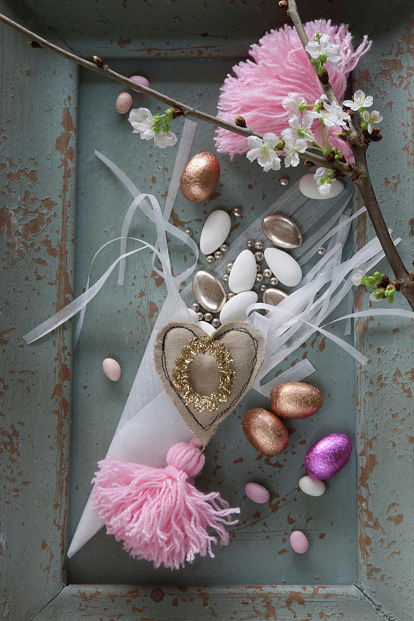 Romantic Easter Arrangement Of Chocolate Eggs And Pin Tassels Photograph by Regina Hippel