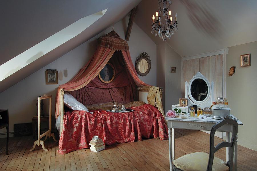 Space Photograph - Romantic, Feminine Attic Bedroom With Rococo Canopy Above Bed And White-painted Dressing Table by Christophe Madamour