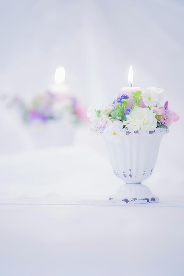 Romantic Flower Arrangement And Lit Candle In Front Of Mirror Photograph by Bildhbsch