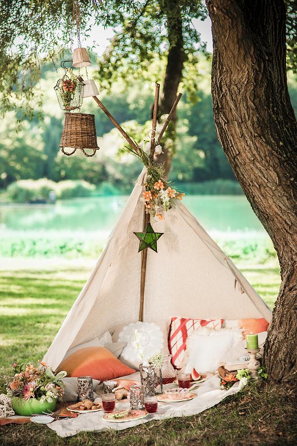 Romantic Picnic In Open-fronted Teepee Under Tree In Idyllic Summer ...