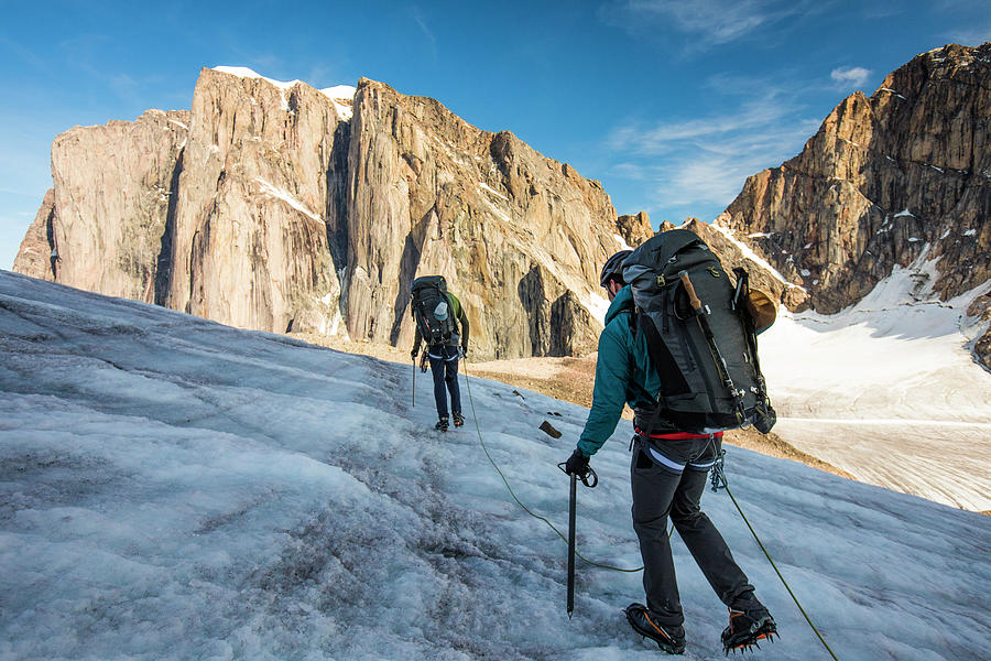 Mountain Photograph - Roped Backpackers Cross A Glacier On Baffin Island.. by Cavan Images