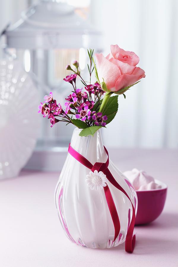 Rose & Waxflowers In Glass Vase Decorated With Satin Ribbon & Button Photograph by Franziska Taube