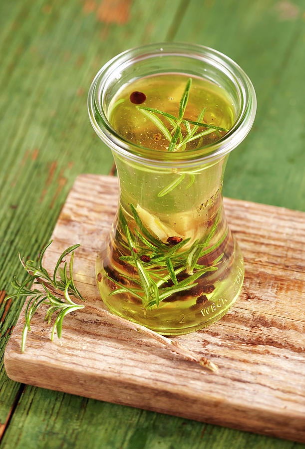 Rosemary Spice Oil With Juniper, Cloves And Pepper Photograph by Teubner Foodfoto