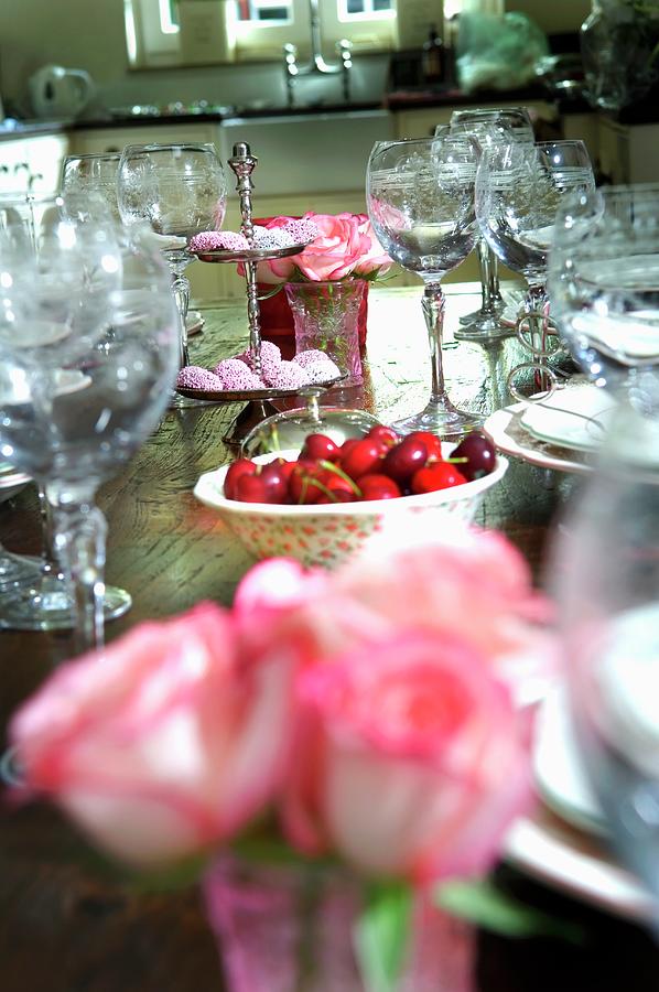 Roses, Cherries And Chocolate Rounds On Laid Table Photograph by Cats, Jolanda