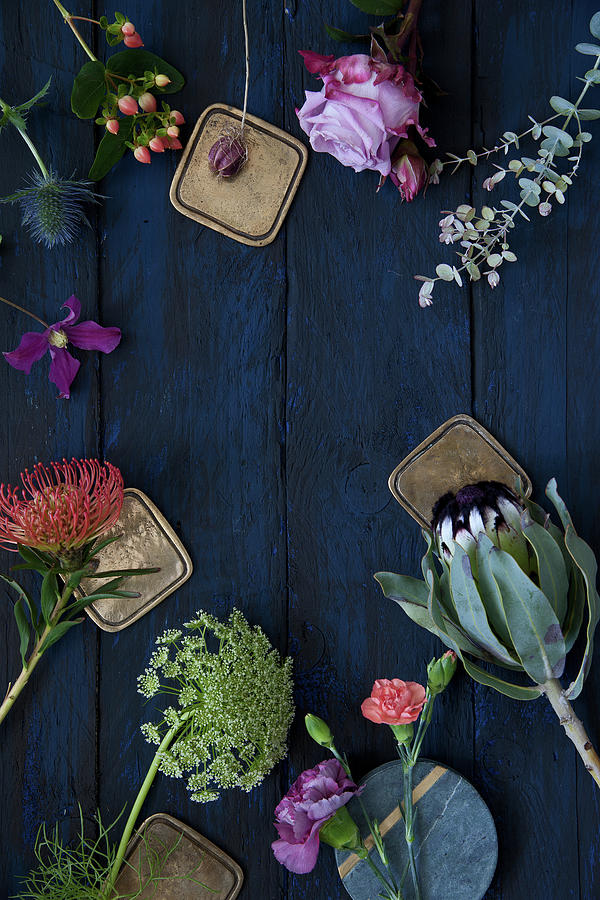 Roses, Pinks, Eucalyptus, Clematis, Proteas, Banksia, St. Johns Wort, Sea Holly And Wild Carrot On Blue Surface Photograph by Elisabeth Berkau