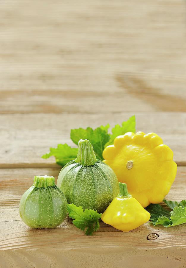 Round Courgettes And Patty-pan Squash Photograph by Antje Plewinski