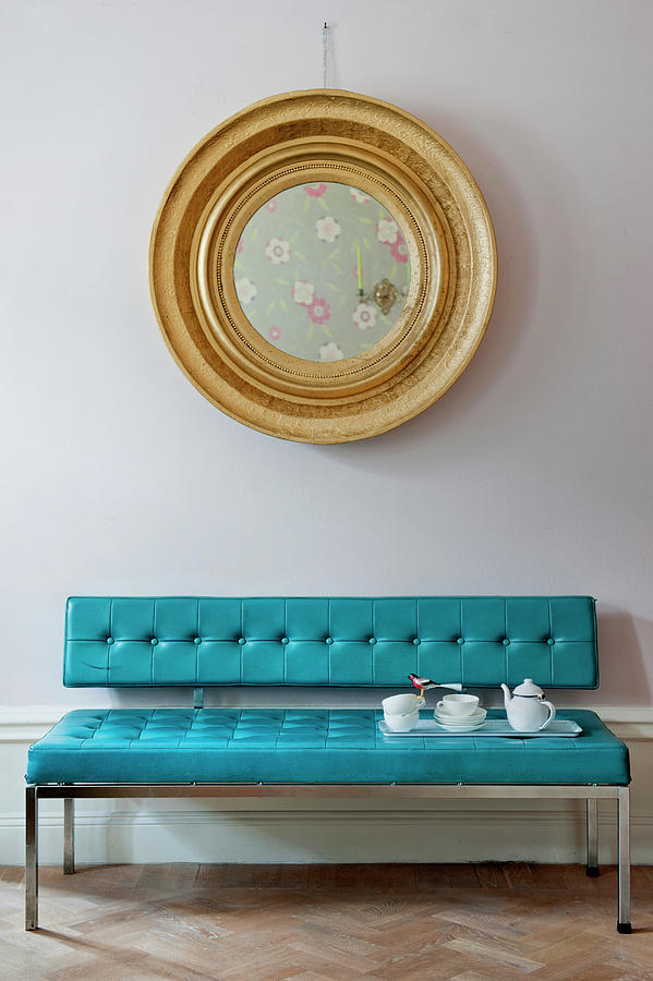 Round Gilt-framed Mirror Above Tea Service On Bright Blue Couch Photograph by Magdalena Bjrnsdotter