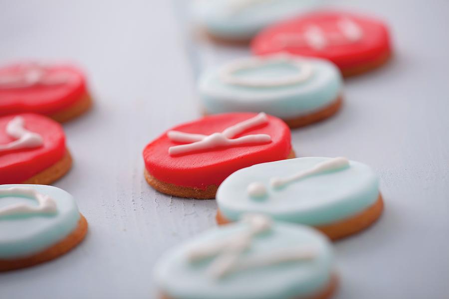 Round Marzipan Biscuits Decorated With Letters Photograph by Studio Lipov