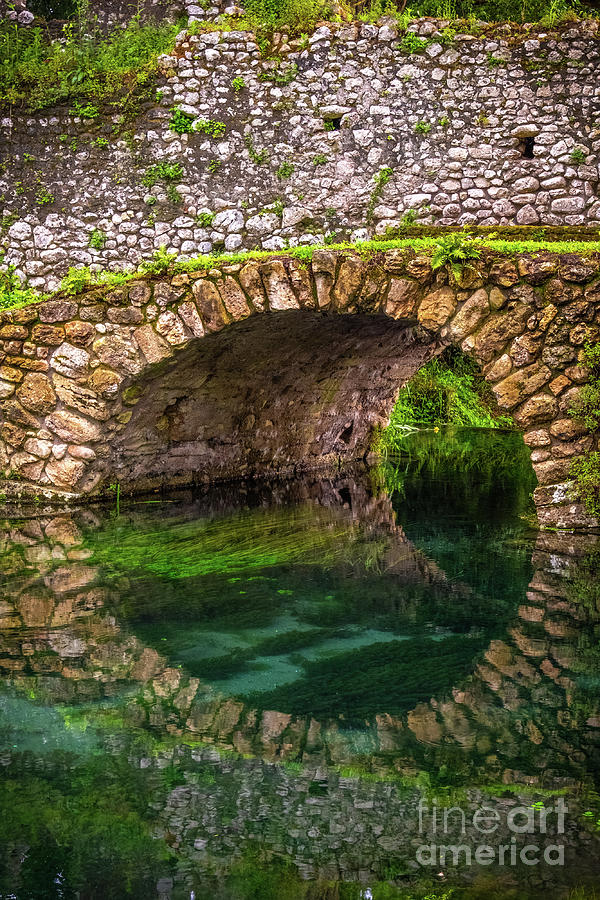 Round Stone Bridge Reflected In River Water Vertical Background Photograph by Luca Lorenzelli