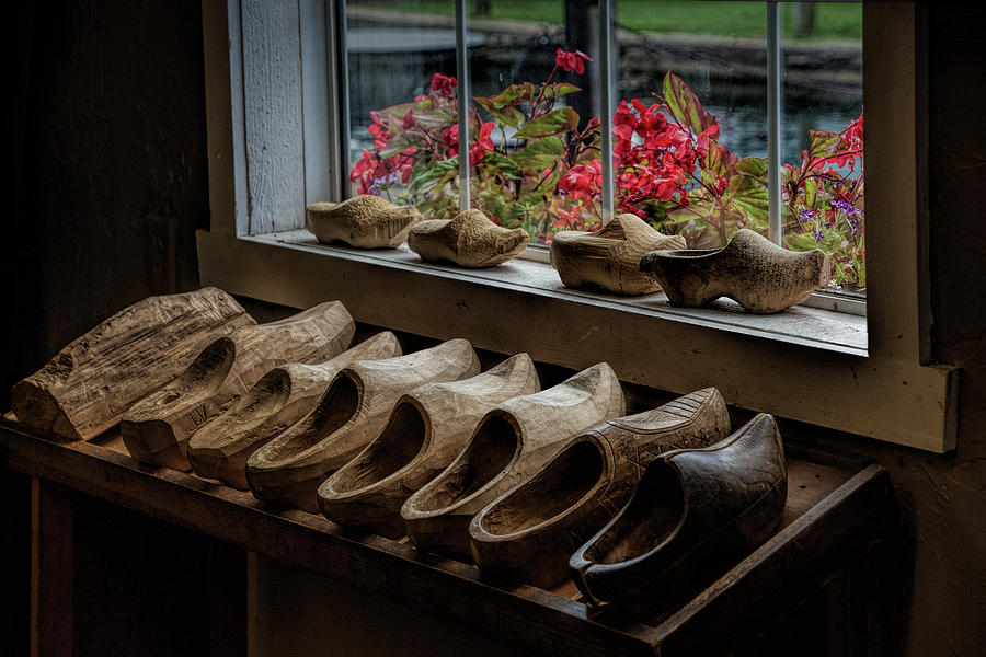 Row of Dutch Wooden Shoes in a Shoe making Shop Photograph by Randall Nyhof