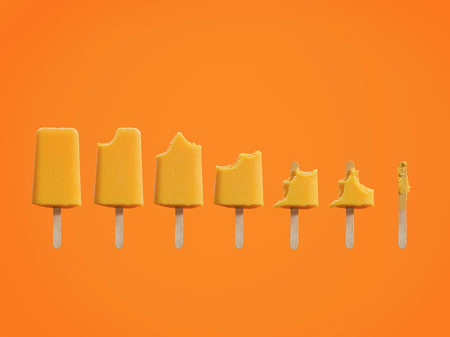 Row Of Ice Cream Lollies Eaten At Photograph by Jonathan Knowles