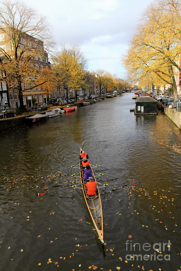 Rowing the Canals Photograph by Paula Guttilla