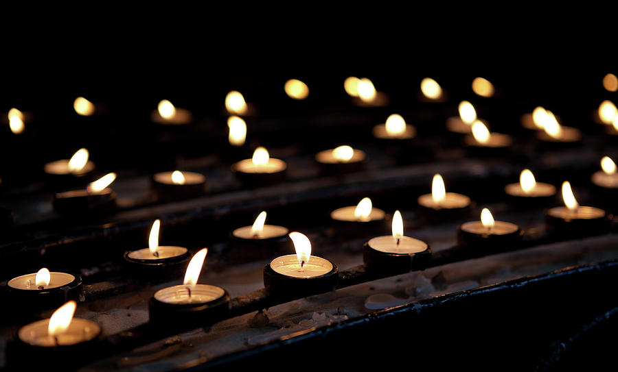 Rows Of Votive Candles In Church by Ldf