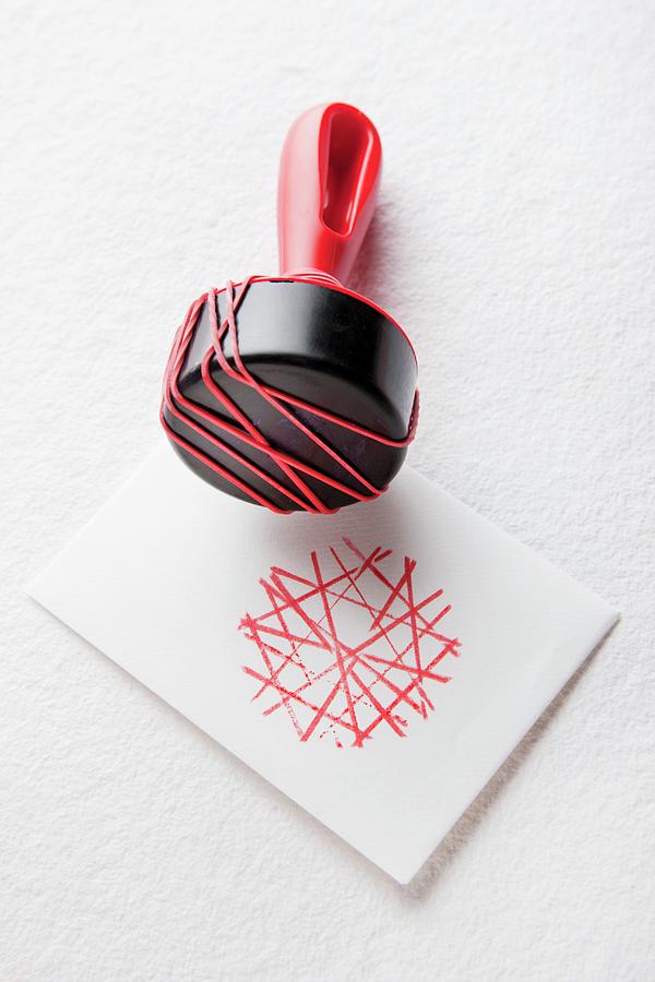 Rubber Bands Stretched Around Stamp Handle To Create Graphic Pattern Photograph by Sabine Lscher