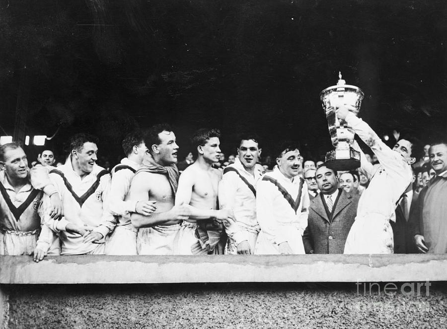 Rugby Players Holding Up Their Trophy Photograph by Bettmann