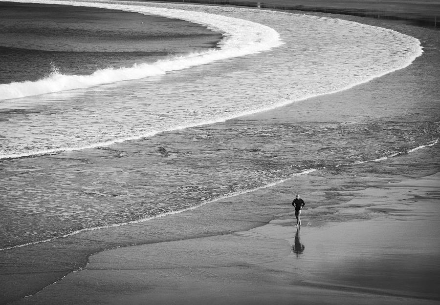 Runner On The Beach Photograph by Adolfo Urrutia