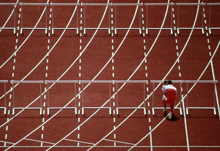 Runner Praying In Front Of Hurdle On Photograph by Grant Faint