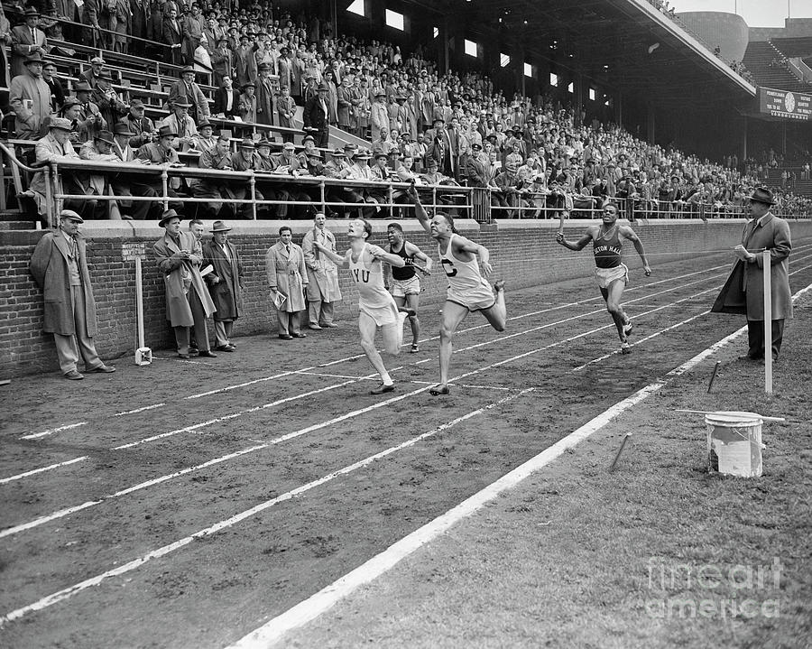 Runners Crossing Finish Line In College Photograph by Bettmann