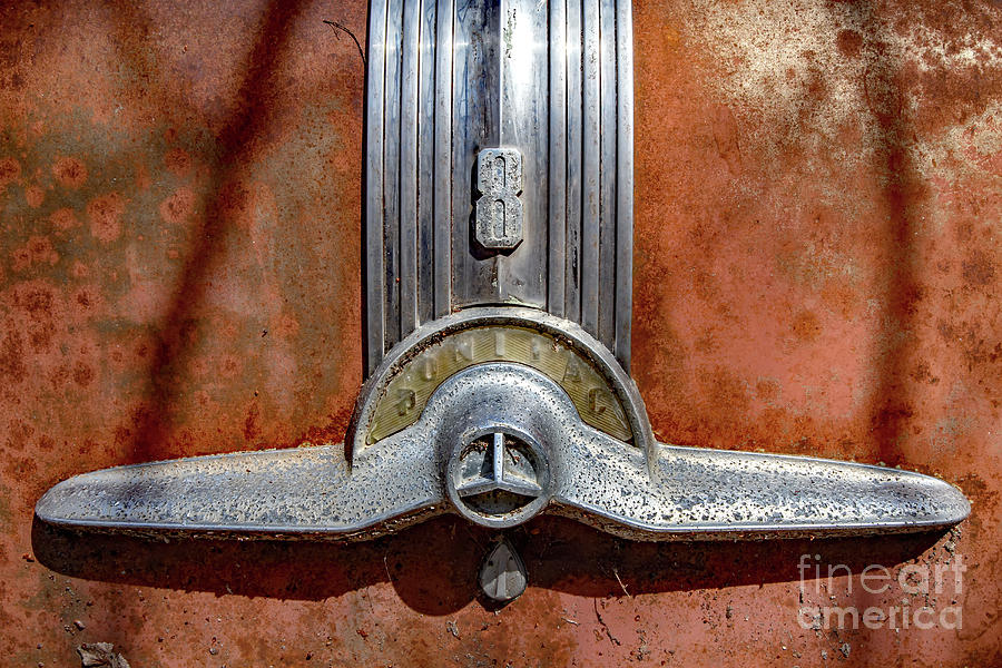 Rustic 51 Pontiac Trunk Emblem Photograph by Kevin Anderson