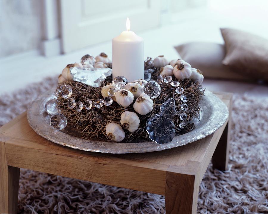 Rustic Advent Wreath Made From Natural Materials And Lit White Candle On Exotic-wood Table Photograph by Matteo Manduzio