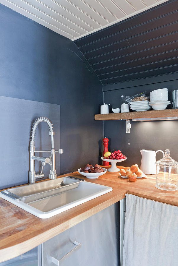 Rustic Kitchen With Grey Walls Under Sloping Ceiling Photograph by Anne-catherine Scoffoni