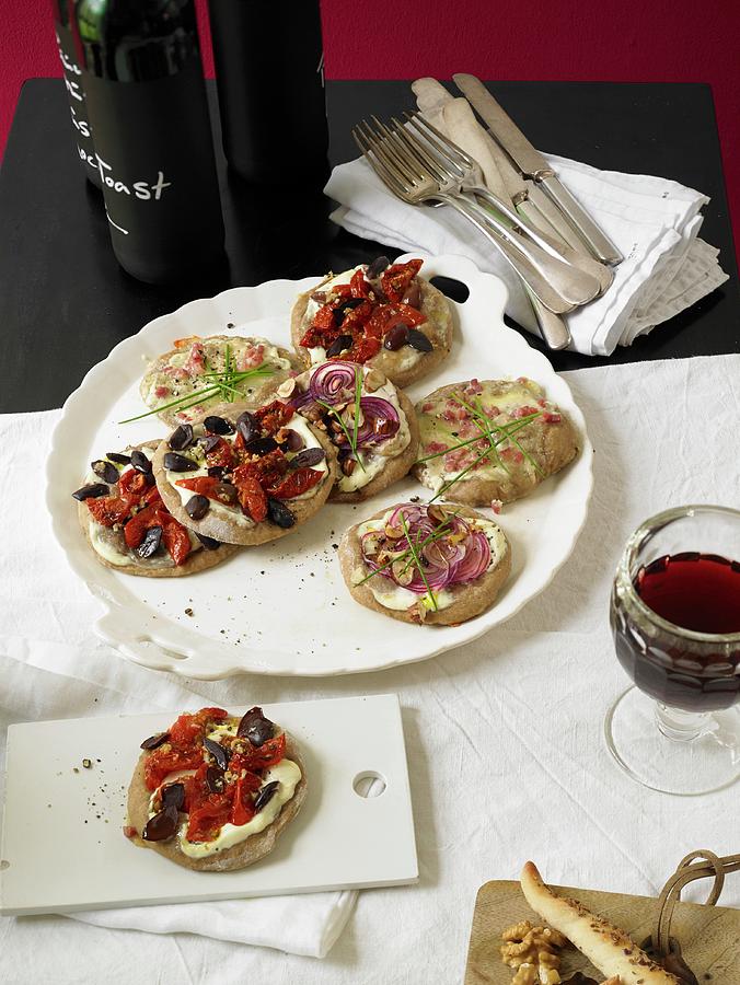 Rustic Mini Breads With Three Different Toppings In A Bistro Photograph by Jan-peter Westermann