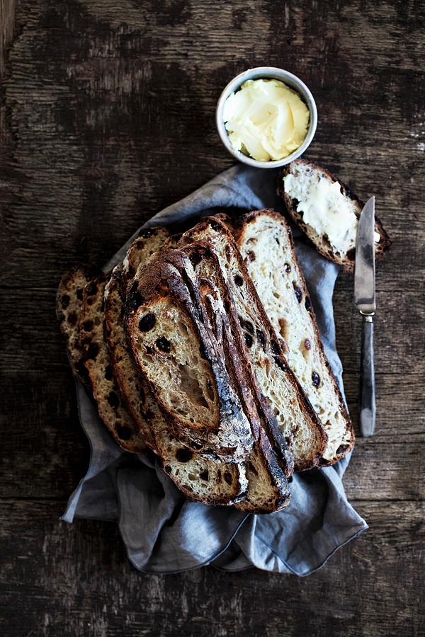 Rustic Olive Bread, Sliced, With Butter Photograph by Veslemy Vrskar