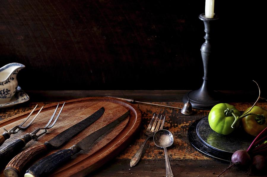 Rustic Table Setting With Knives, Forks And Tomatoes Photograph by Edward Thomas