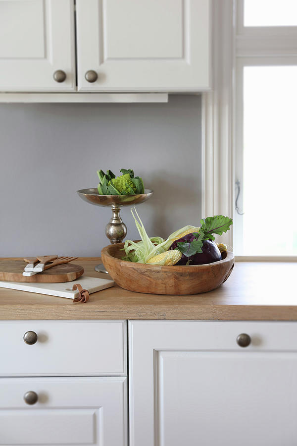 Rustic Wooden Bowl And Vegetables On Silver Cake Stand In Kitchen Photograph by Annette Nordstrom