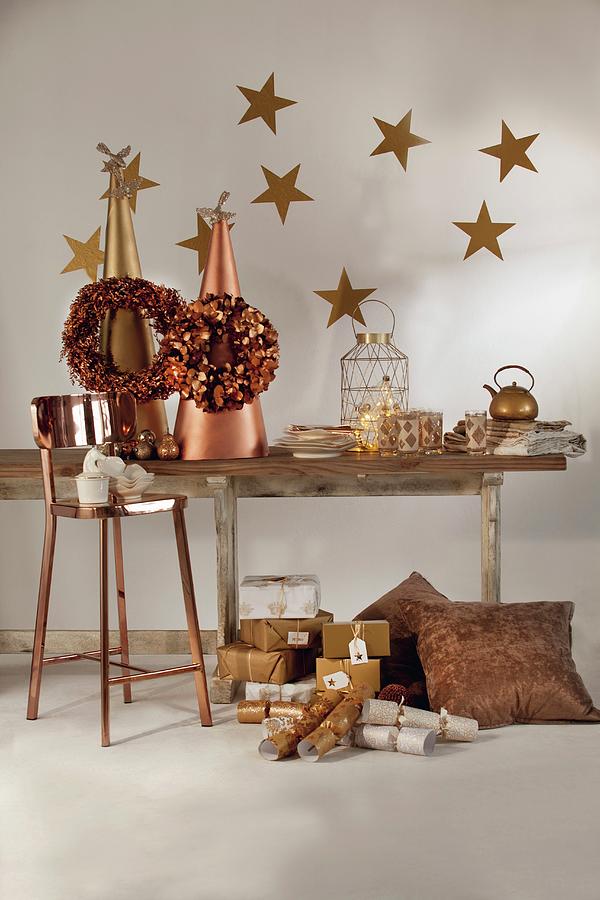 Rustic Wooden Table Festively Decorated In Gold And Bronze With Bar Stool And Christmas Presents Arranged On Floor Photograph by Great Stock!