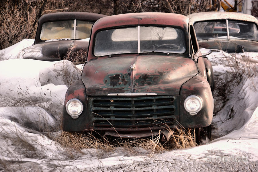 Rusting in drifts of snow Photograph by Jeff Swan