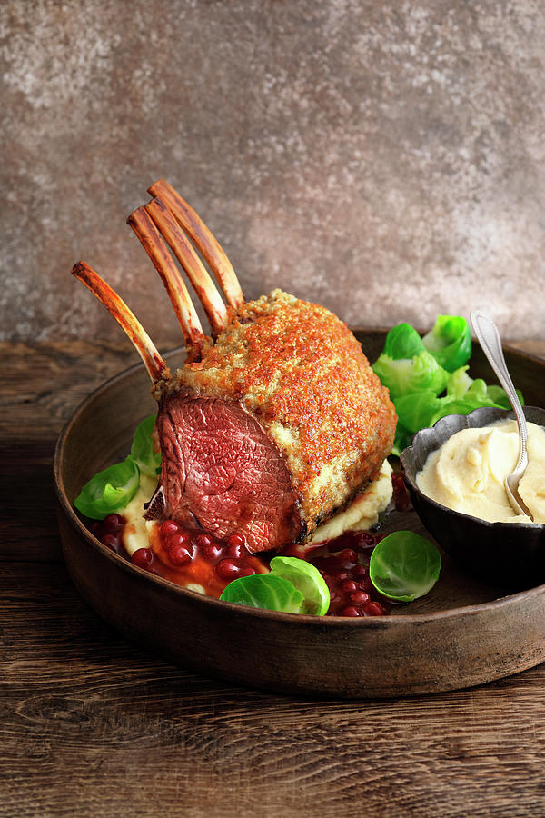 Saddle Of Venison With A Chestnut Crust On A Madeira And Lingonberry Sauce Photograph by Jalag / Mathias Neubauer