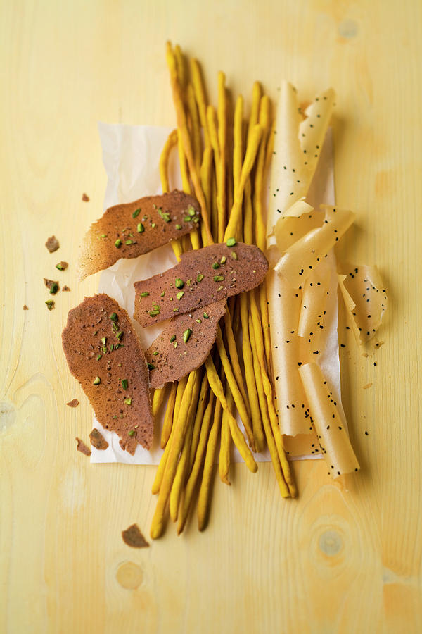Saffron Breadsticks, Spice And Lentil Crackers, Potato Chips With Black Cumin Photograph by Michael Wissing